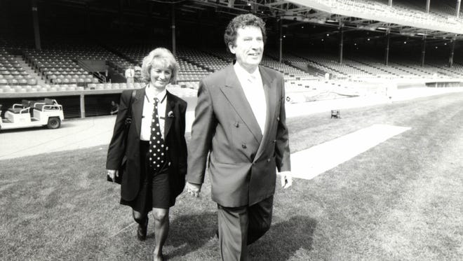 Detroit Tigers owners Mike and Marian Ilitch take the field at Tiger Stadium.