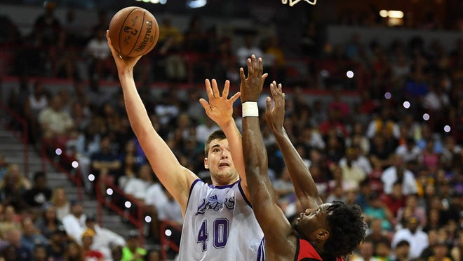 Los Angeles Lakers center Ivica Zubac (40) shoots over the defense of Portland Trail Blazers forward Caleb Swanigan (50) during the NBA Summer League final.