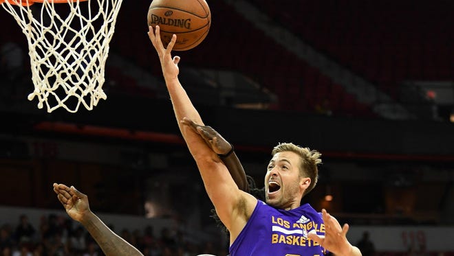 Los Angeles Lakers forward Travis Wear (21) shoots during an NBA Summer League playoff game against the Dallas Mavericks.