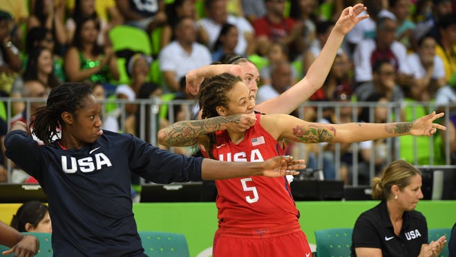 USA players celebrate on the sidelines against China during the women's preliminary round in the Rio 2016 Summer Olympic Games at Youth Arena.