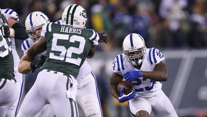 Indianapolis Colts running back Frank Gore (23) carries for a 6 yard gain against the New York Jets during the second half at MetLife Stadium in East Rutherford, N.J., on Monday, Dec. 5, 2016.