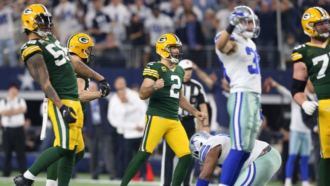 Packers kicker Mason Crosby (2) reacts after making a field goal to take the lead during the fourth quarter against the Cowboys.