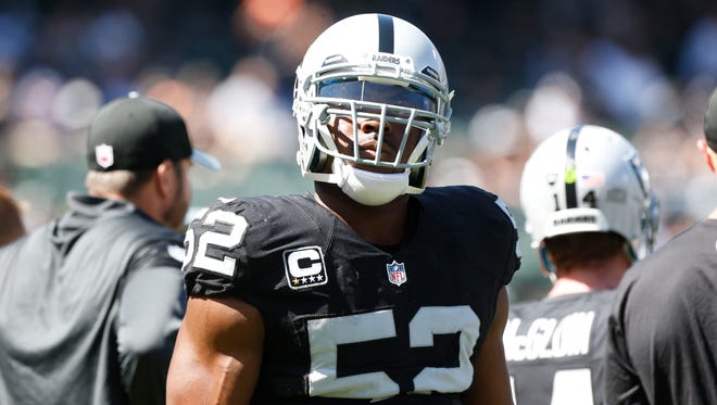 Sep 18, 2016; Oakland, CA, USA; Oakland Raiders defensive end Khalil Mack (52) stands on the field before the start of the game against the Atlanta Falcons at Oakland-Alameda County Coliseum. Mandatory Credit: Cary Edmondson-USA TODAY Sports ORG XMIT: USATSI-268280 ORIG FILE ID:  20160918_sal_se9_104.JPG