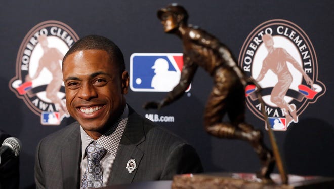 New York Mets' Curtis Granderson smiles at a news conference as he receives the 2016 MLB Roberto Clemente Award before Game 3 of the Major League Baseball World Series Friday, Oct. 28, 2016, in Chicago. Granderson received the award for being a positive role model for Major League Baseball, on and off the field. He’s the fourth Met to be awarded this honor.