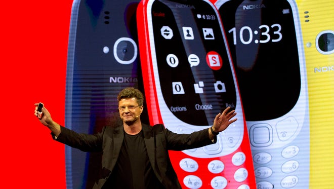 Arto Nummela, Chief Executive Officer at HMD Global, shows the new re-launched Nokia 3310 phone.