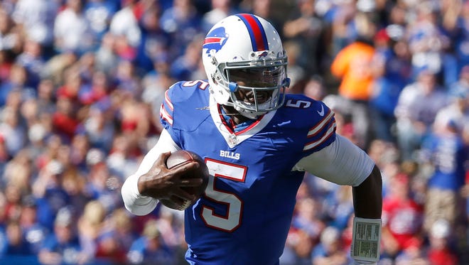 Buffalo Bills quarterback Tyrod Taylor (5) runs the ball in for a touchdown during the second half against the Arizona Cardinals at New Era Field.