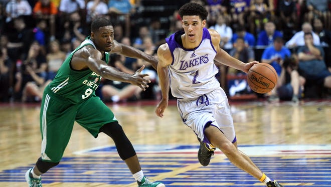 Los Angeles Lakers guard Lonzo Ball (2) dribbles against Boston Celtics guard Demetrius Jackson (9) during the first half at Thomas & Mack Center.