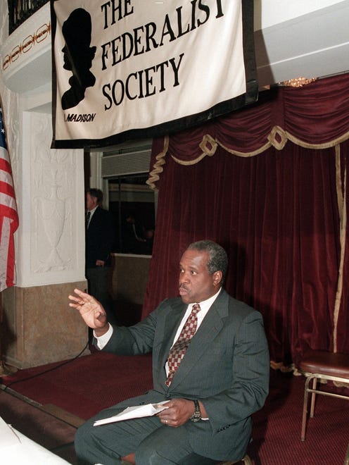 Thomas prepares to address the Federalist Society's national meeting on Sept. 22, 1995, in Washington.
