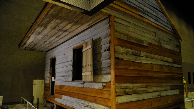 A weatherboard-clad slave cabin used during slavery at Point of Pines Plantation on Edisto Island, S.C.  is on display at the Smithsonian National Museum of African American History and Culture.
