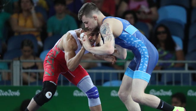 Jesse David Thielke of the United States competes against Mahadi Messaoudi El of Morocco during the men's greco roman 59g kg wrestling 1/8 finals in the Rio 2016 Summer Olympic Games at Carioca Arena 2.