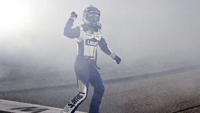Chase finale: Jimmie Johnson celebrates at the start/finish line after winning the Sprint Cup championship. Johnson tied legends Richard Petty and Dale Earnhardt Sr. with his seventh career title.