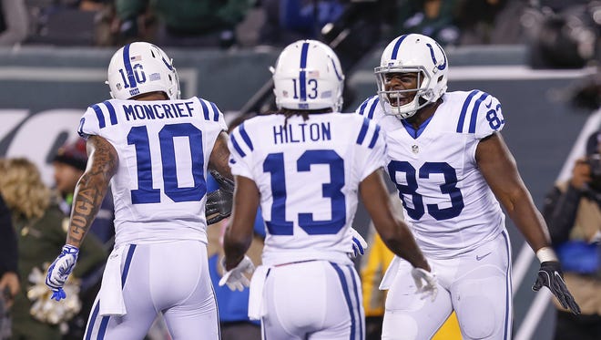 Indianapolis Colts tight end Dwayne Allen (83), right, celebrates with Donte Moncrief (10), and T.Y. Hilton (13) after scoring against the New York Jets on a 7 yard screen pass from quarterback Andrew Luck during the first quarter at MetLife Stadium in East Rutherford, N.J., on Monday, Dec. 5, 2016.