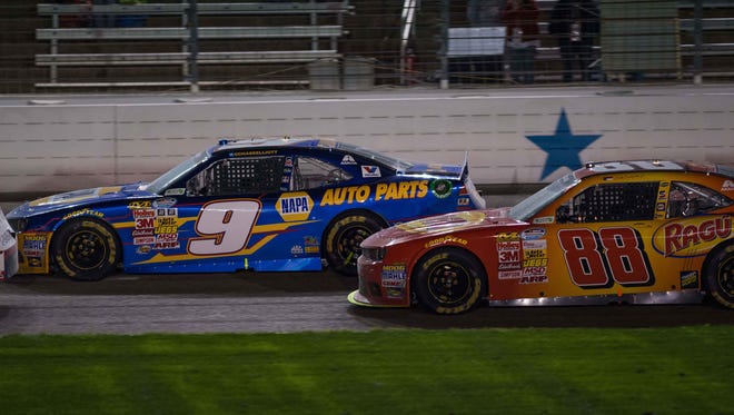 Chase Elliott (9) and driver Dale Earnhardt Jr. (88) during the O'Reilly Auto Parts 300 at Texas Motor Speedway.