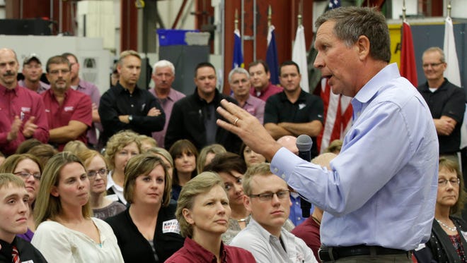 John Kasich speaks during a campaign rally at the Coldwater Machine Company on Oct. 13, 2014, in Coldwater, Ohio.