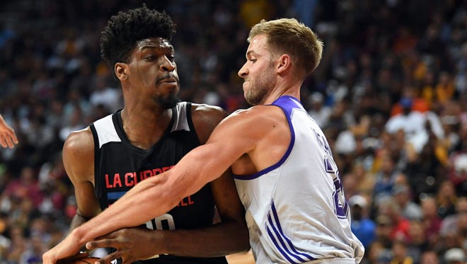 Los Angeles Lakers forward Travis Wear (21) attempts to steal the ball from Los Angeles Clippers center Shevon Thompson (29) during an NBA Summer League game at Thomas & Mack Center.