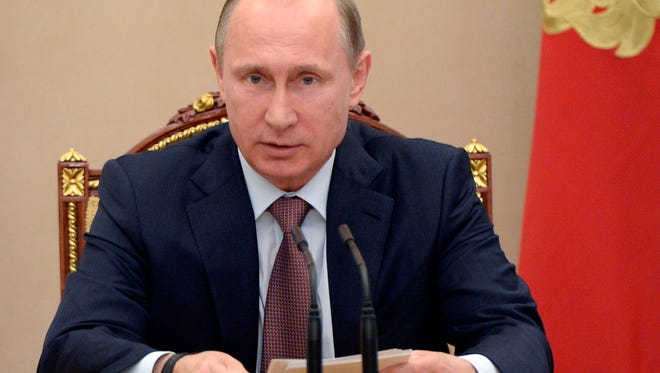 Russian President Vladimir Putin speaks at a Security Council meeting in the Kremlin on July 3, 2015.
