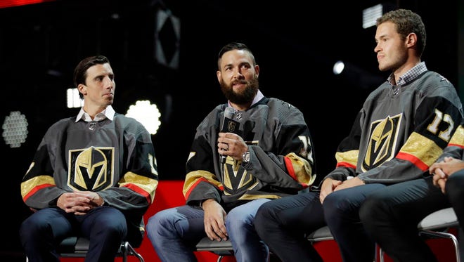 Vegas Golden Knights' Marc-Andre Fleury, Deryk Engelland and Brayden McNabb, from left, sit on stage during an event following the NHL expansion draft.