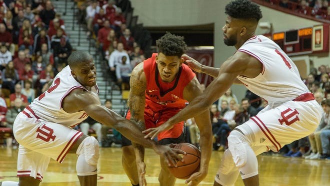 Rutgers Scarlet Knights guard Corey Sanders has the ball knocked away by Indiana Hoosiers guard Robert Johnson and guard Josh Newkirk in the second half of the game at Assembly Hall.