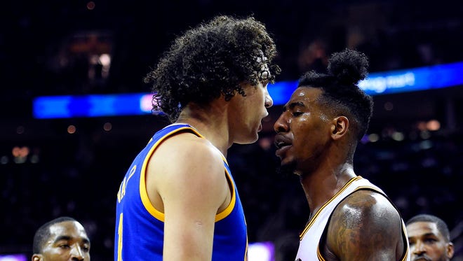 Golden State Warriors guard Leandro Barbosa (19) confronts Cleveland Cavaliers guard Iman Shumpert (4) after a play during the second quarter in Game 6 of the NBA Finals at Quicken Loans Arena.