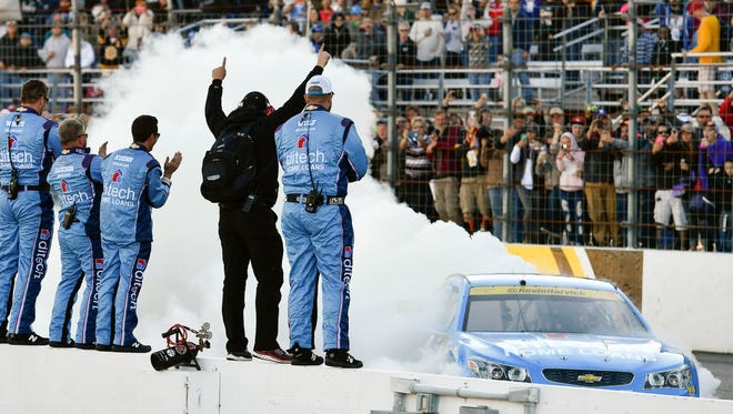 Round 1: Kevin Harvick does a burnout in front of his crew after wining at New Hampshire Motor Speedway on Sept. 25 and securing a berth in the second round.