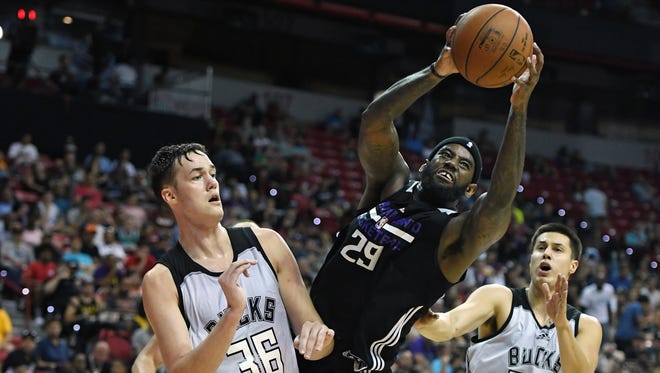 JaKarr Sampson #29 of the Sacramento Kings grabs a rebound against Stephen Zimmerman #36 and Bronson Koenig #24 of the Milwaukee Bucks during the 2017 Summer League at the Thomas & Mack Center on July 12, 2017 in Las Vegas, Nevada.
