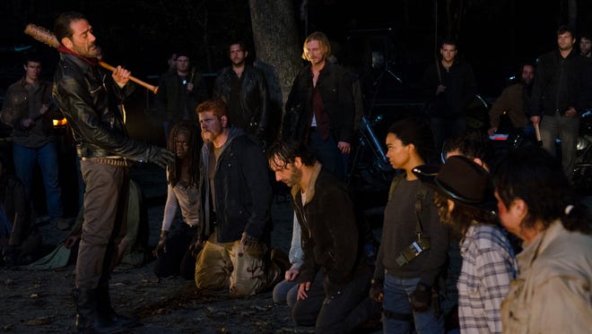 Negan (Jeffrey Dean Morgan), left, hovers over 'Walking Dead' survivors, including Michonne (Danai Gurira), Abraham (Michael Cudlitz), Rick (Andrew Lincoln) and Sasha (Sonequa Martin-Green).