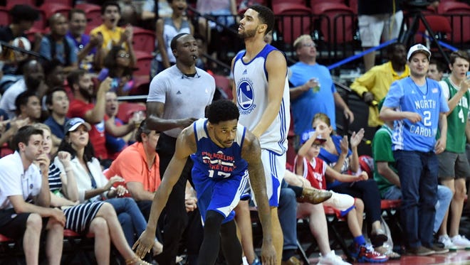 Philadelphia 76ers guard Larry Drew II (17) reacts after his game-winning shot as Golden State Warriors forward Noah Allen (18) reacts during the second half at Thomas & Mack Center.