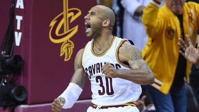 Cleveland Cavaliers guard Dahntay Jones (30) celebrates during the second quarter in Game 6 of the NBA Finals against the Golden State Warriors at Quicken Loans Arena.