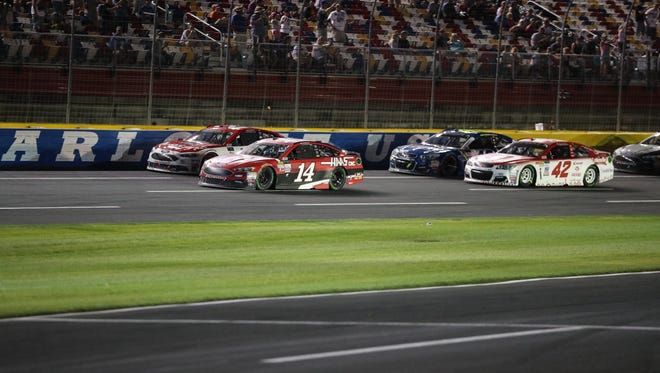 Monster Energy NASCAR Cup Series driver Clint Bowyer (14) leads in an early segment during the Monster Energy NASCAR All-Star Race at Charlotte Motor Speedway.