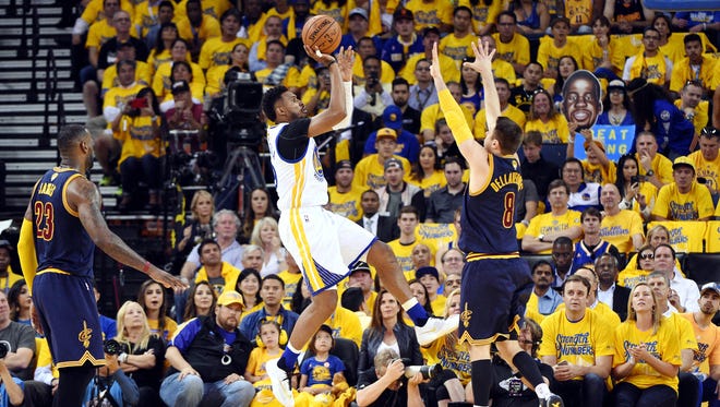 Golden State Warriors guard Leandro Barbosa (19) shoots the ball over Cleveland Cavaliers guard Matthew Dellavedova (8) during the second quarter in game one of the NBA Finals at Oracle Arena.