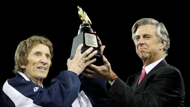Mike Ilitch  Dave Dombrowski lift the William Harridge Trophy after their team won the American League championship series against the New York Yankees at Game 4, Thursday, Oct. 18, 2012, in Detroit. The Tigers, who won 8-1, move on to the World Series.