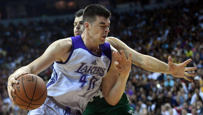 Los Angeles Lakers center Ivica Zubac (40) dribbles against Boston Celtics center Ante Zizic (54) during the first half at Thomas & Mack Center.