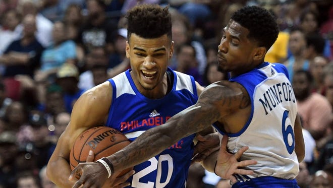 Philadelphia 76ers guard Timothe Luwawu-Cabarrot (20) drives against Golden State Warriors guard Xavier Munford (6) during the first half at Thomas & Mack Center.