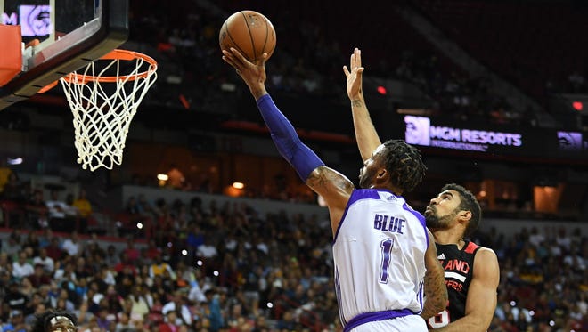 Los Angeles Lakers guard Vander Blue (1) shoots against the defense of Portland Trail Blazers forward Josh Scott (16) during the NBA Summer League final.