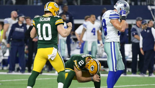 Packers kicker Mason Crosby (2) celebrates after making the game-winning field goal against the Cowboys.