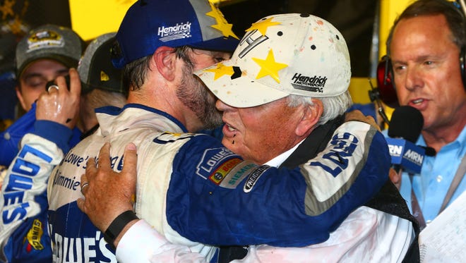 Chase finale: Jimmie Johnson gets a hug from team owner Rick Hendrick after winning the Sprint Cup championship.