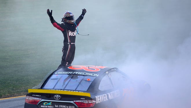 Martin Truex Jr. celebrates after winning the Teenage Mutant Ninja Turtles 400 Sunday at Chicagoland Speedway.