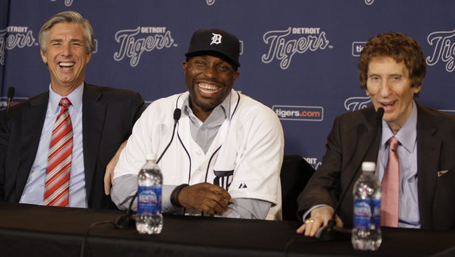 Detroit Tigers President, CEO & GM David Dombrowski with Torii Hunter  and Tigers owner Mike Ilitch during the press conference introducing Hunter in 2012.