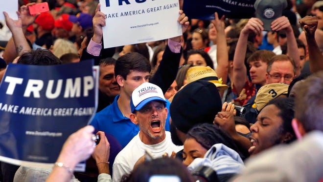 A supporter of Republican presidential candidate Donald Trump yells at protestors who were chanting Black Lives Matter, while Trump was speaking at a campaign rally in New Orleans on March 4, 2016.