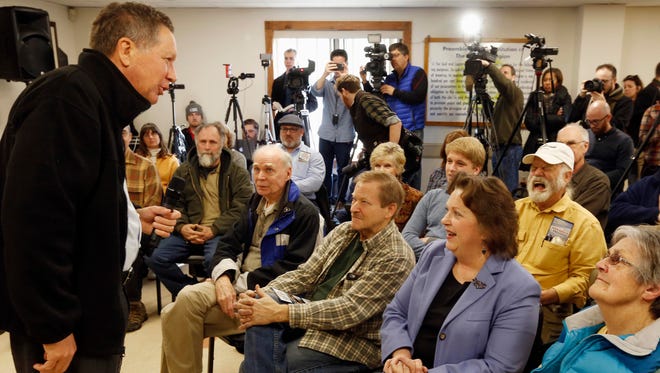 Kasich talks to voters during a campaign stop on Feb. 1, 2016, in Rochester,  N.H.