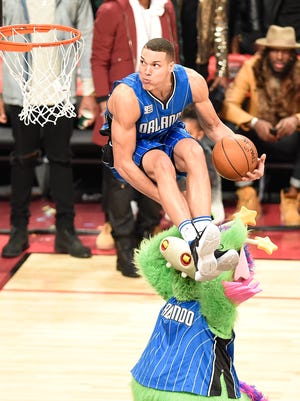 Orlando Magic player Aaron Gordon (00) dunks the ball over Magic mascot "Stuff" during the slam dunk contest during the All-Stars Saturday Night at Air Canada Centre.