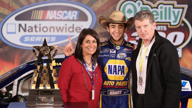 Chase Elliott celebrates in victory lane with his parents Cindy and Bill after the O'Reilly Auto Parts 300 at Texas Motor Speedway.