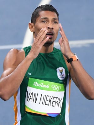 Wayde Van Niekerk reacts after winning the men's 400-meter final.