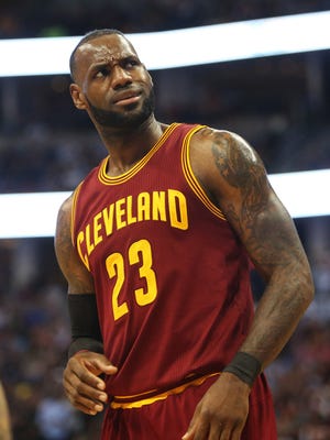 Cleveland Cavaliers forward LeBron James (23) reacts during the first half against the Denver Nuggets at Pepsi Center.