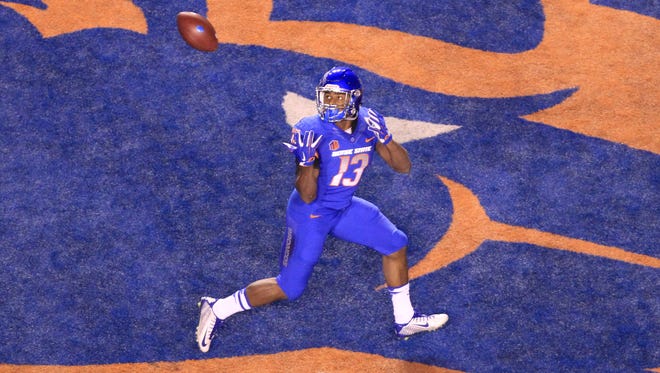 Boise State running back Jeremy McNichols catches a touchdown pass against BYU at Albertsons Stadium.
