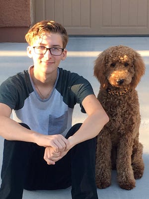 Joey Hudy, pictured in October 2016 with his mother Julie's dog, Molly.