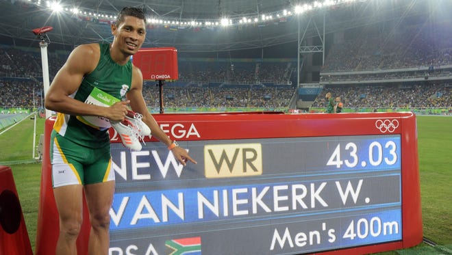 Wayde Van Niekerk of South Africa smashes the 400 world record.