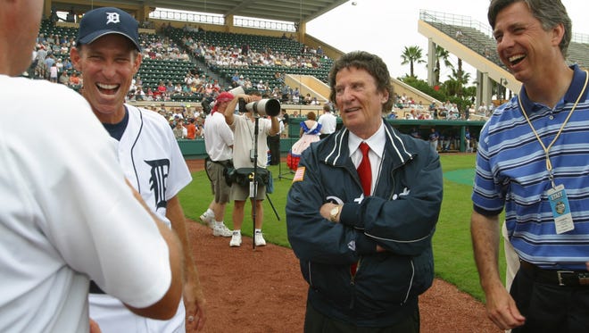 Tigers manager Alan Trammell, owner Mike Ilitch and GM David Dombrowski share a laugh  prior to the Tigers and LA Dogers spring training game a in Lakeland in 2003.