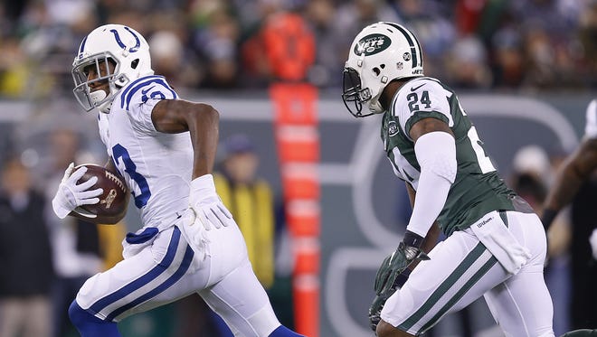 Indianapolis Colts wide receiver T.Y. Hilton (13) carries past New York Jets cornerback Darrelle Revis (24) during the 1st half at MetLife Stadium in East Rutherford, N.J., on Monday, Dec. 5, 2016.