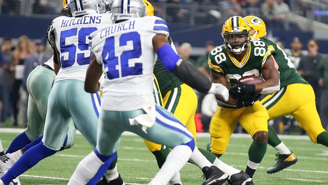 Green Bay Packers running back Ty Montgomery (88) runs for a touchdown during the second quarter against the Dallas Cowboys in the NFC Divisional playoff game at AT&T Stadium.